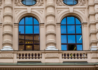 Arched windows in the wall of an old building in the city.