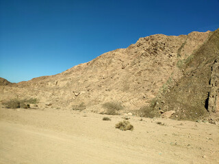 Desert land with mountains and sea