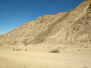 Fototapeta na wymiar Desert land with mountains and sea