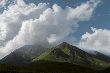 summer mountain landscape. clouds over the peaks