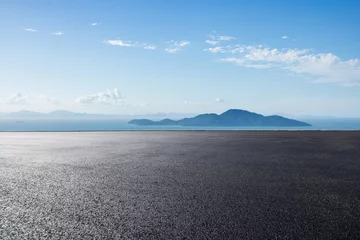 Fototapeten Asphalt road and sea with island natural landscape in summer © ABCDstock