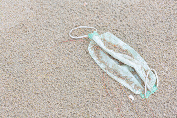Fototapeta na wymiar beach trash mask environmental concept