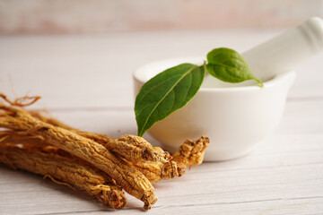 Ginseng roots and green leaf, healthy food.