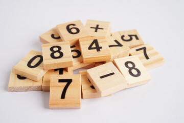 Number wood block cubes for learning Mathematic, education math concept.