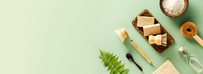 Eco friendly cleaning accessories, baking soda, wooden brushes, vinegar, salt, soap.