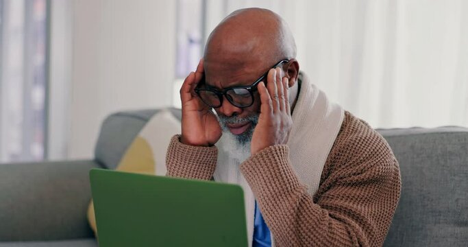 Senior man, headache and stress on laptop and sofa for online mistake, asset management or debt at home. Elderly person with anxiety and pain for mortgage news, scam or phishing email on his computer