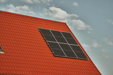 Fototapeta premium House with solar panels. Concept of sustainable and renewable energy.