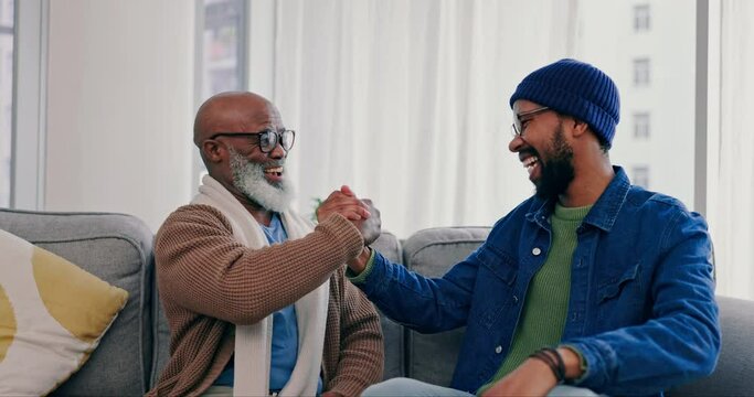 Family, handshake and laughing on sofa with greeting, motivation and fun with man and grandpa. Living room, support and love in a lounge together with a happy smile, solidarity and black people