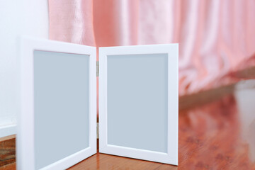 Fototapeta premium Blank picture frame with empty space on the headboard.