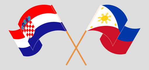 Crossed and waving flags of Croatia and the Philippines