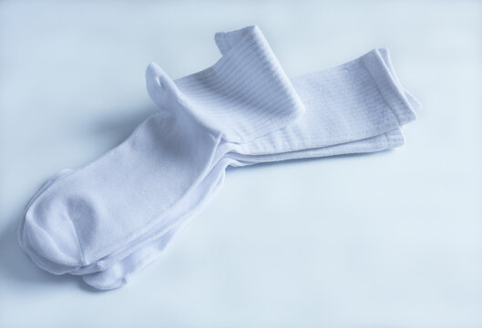 Cotton socks on a white background. Selective focus. 