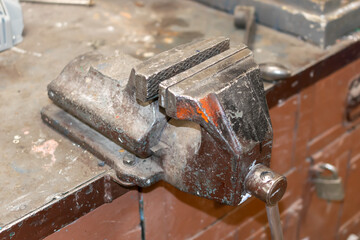 vise on a bronze workbench