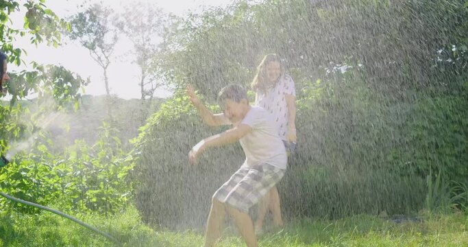 kid, mother, hose, water, child, outdoor, family, summer, garden, fun, people, girl, splash, happy, spray, joy, grass, childhood, parent, sprinkler, playing, happiness, green, mom, woman, leisure, dro