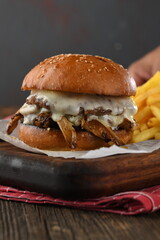 Delicious oyster mushroom burger with french fries on a wooden plate
restaurant shoot
