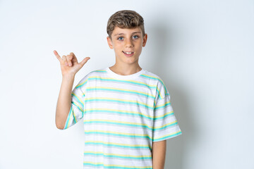 Beautiful kid boy wearing striped casual t-shirt showing up number six Liu with fingers gesture in sign Chinese language