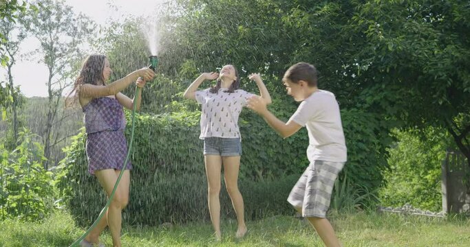 kid, mother, hose, water, child, outdoor, family, summer, garden, fun, people, girl, splash, happy, spray, joy, grass, childhood, parent, sprinkler, playing, happiness, green, mom, woman, leisure, dro