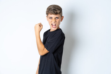 Profile side view portrait Beautiful kid boy wearing black casual t-shirt celebrates victory