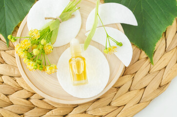 Small roll-on bottle with linden (tilia, basswood, lime tree) perfume oil. Natural beauty treatment.