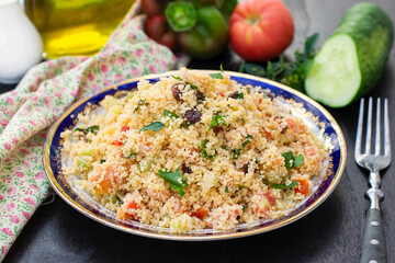 Traditional Mediterranean Levantine salad Tabbouleh with couscous and fresh summer vegetables - 638813373