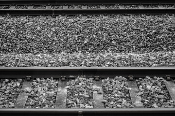 Top view of Double Railroad Train tracks with gravel and platform at the station