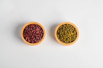 Red kidney beans and Mung beans in a basket wooden isolated on white background