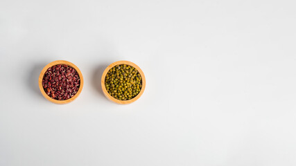 Red kidney beans and Mung beans in a basket wooden isolated on white background