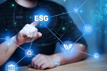 ESG environment social governance investment business concept,Asian man sitting using a computer to analyze ESG,Environment world day	
