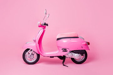 Fototapeta na wymiar Profile side photo of speed transport retro bike moped for girls isolated on vivid pink color background