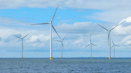 windmill park in the ocean aerial view with wind turbine Flevoland Netherlands Ijsselmeer. Green energy 
