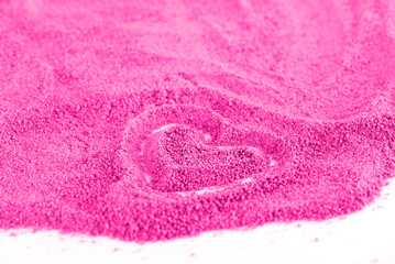 Fototapeta na wymiar Heart on pink sand or sugar, love for pink, barbie pink, barbie core.
