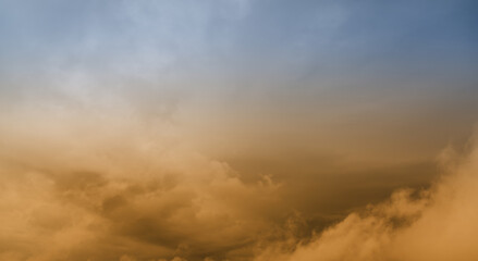 Sunset sky with orange clouds. Nature background.