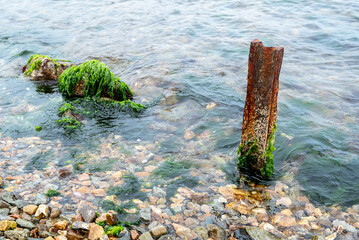 Waves at the seashore. Selective focus with shallow depth of field.