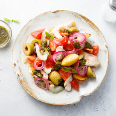 Healthy potato salad with tomatoes and olives