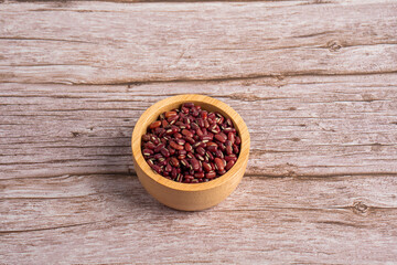 Red kidney beans in a basket wooden isolated on wood background