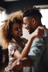 shot of a happy young man and woman dancing together at home
