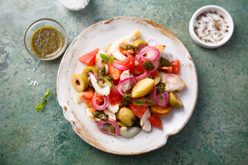 Healthy potato salad with tomatoes and olives