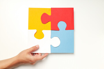 Four puzzle pieces on white background. World autism day concept