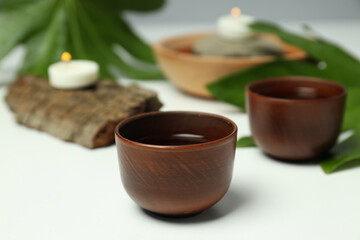 Obraz na płótnie Canvas Cozy and tasty hot drink concept - asian tea