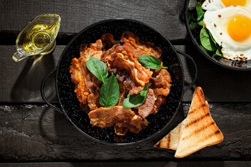 Tasty breakfast and delicious meat food concept - fried bacon
