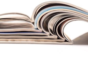 Stack of magazines on white background