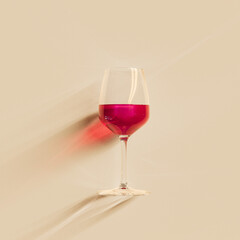 Single glass of red wine with caustic effect, creative concept 3d rendering