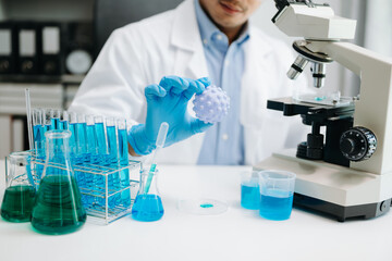 Fototapeta premium Mmale biotechnologist testing new chemical substances in a laboratory...