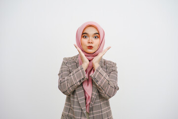 Image of excited young muslim businesswoman pink hijab standing isolated over white background. Looking camera.