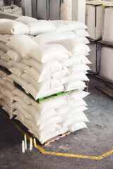 several sacks stacked on pallets