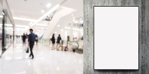 Blank billboard in a modern shopping center. Display for mock-up and advertising. Background with...