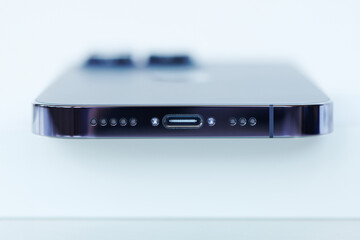 Bottom part of modern smartphone with high speed usb type-c communication port. Universal USB type-c charge standard for smartphone. up-to-date technologies for communication. Close up view.