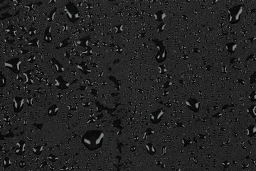 Water drops on dark stone