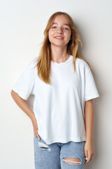 Obraz premium Portrait of young beautiful cute teen girl posing at camera