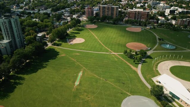 Drone View of four Green Baseball Fields, Baseball Diamond, Sports Field, Public Park in Downtown Halifax, Canada. Empty Baseball Fields and Green Grass in a Sports Park.