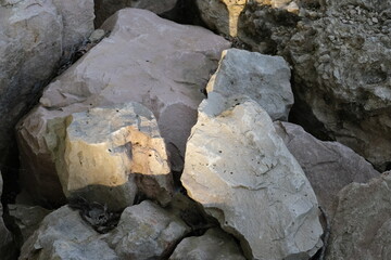 Large, sunlit rocks.